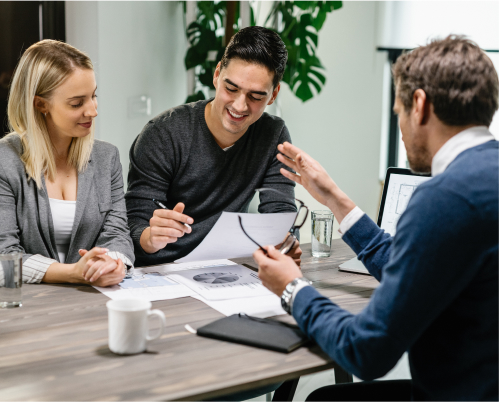 A financial advisor meeting with a younger couple